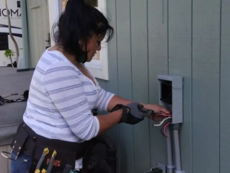 Licensed electrician wiring an exterior subpanel in Rockton